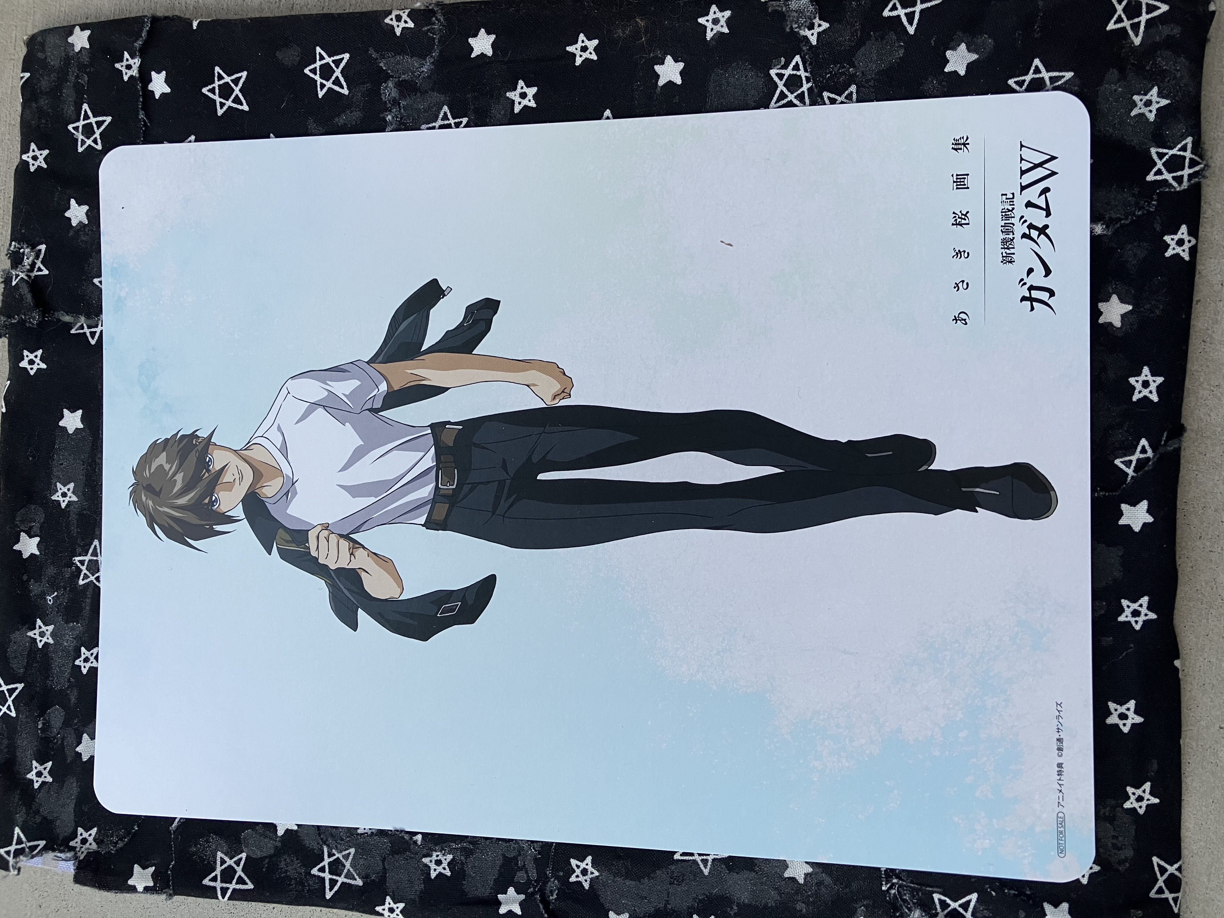 Art board of Gundam wing Heero in his preventer uniform holding his jacket over his shoulder.